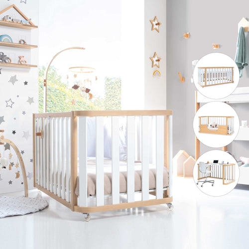 habitación de bebé en blanco con cuna Crea Plus Due y gimnasio infantil montessori